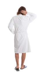 Photo of Young man in bathrobe on white background