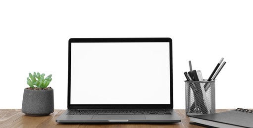 Photo of Computer, potted plant and stationery on table against white background. Stylish workplace