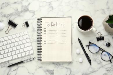 Flat lay composition with unfilled To Do list, computer keyboard and cup of coffee on white marble table