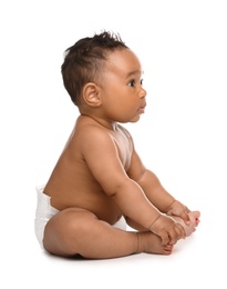 Adorable African-American baby in diaper on white background