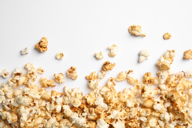 Delicious caramel popcorn on white background, top view