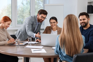 Team of employees working together in office