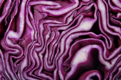 Photo of Texture of cut red cabbage as background, closeup