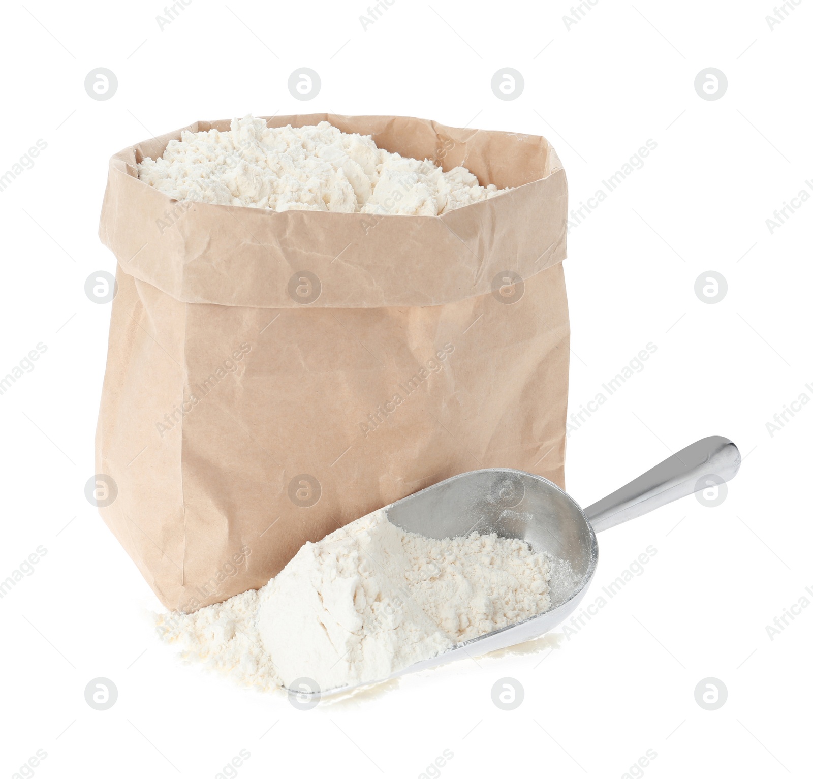 Photo of Paper bag and scoop with flour isolated on white