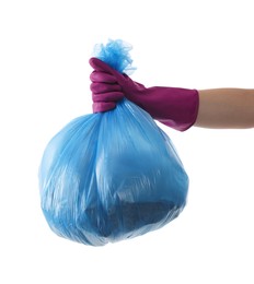 Photo of Woman holding plastic bag full of garbage on white background, closeup