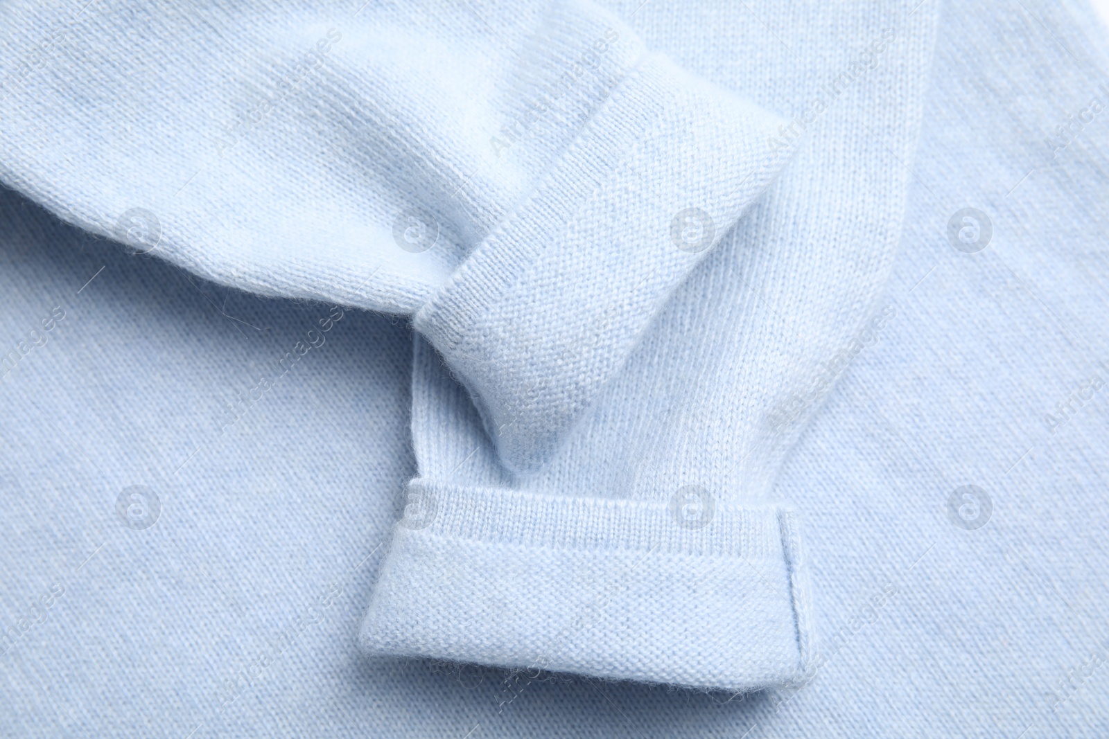 Photo of Warm cashmere sweater as background, top view