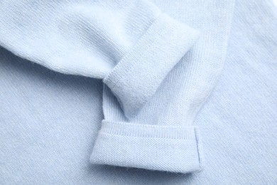 Photo of Warm cashmere sweater as background, top view