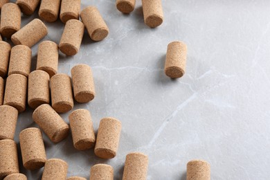 Photo of Wine bottle corks on light grey marble table