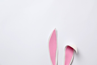 Funny Easter bunny ears on white background, top view