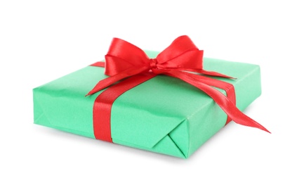 Photo of Christmas gift box decorated with ribbon bow on white background