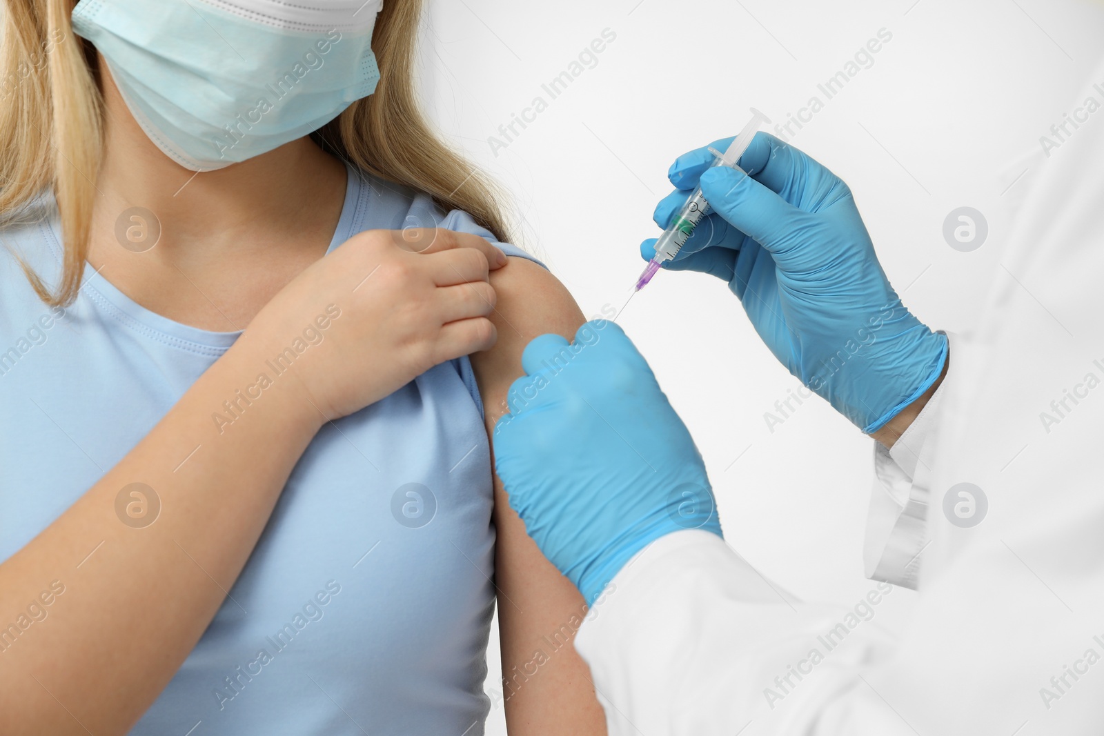Photo of Doctor giving hepatitis vaccine to patient on white background, closeup