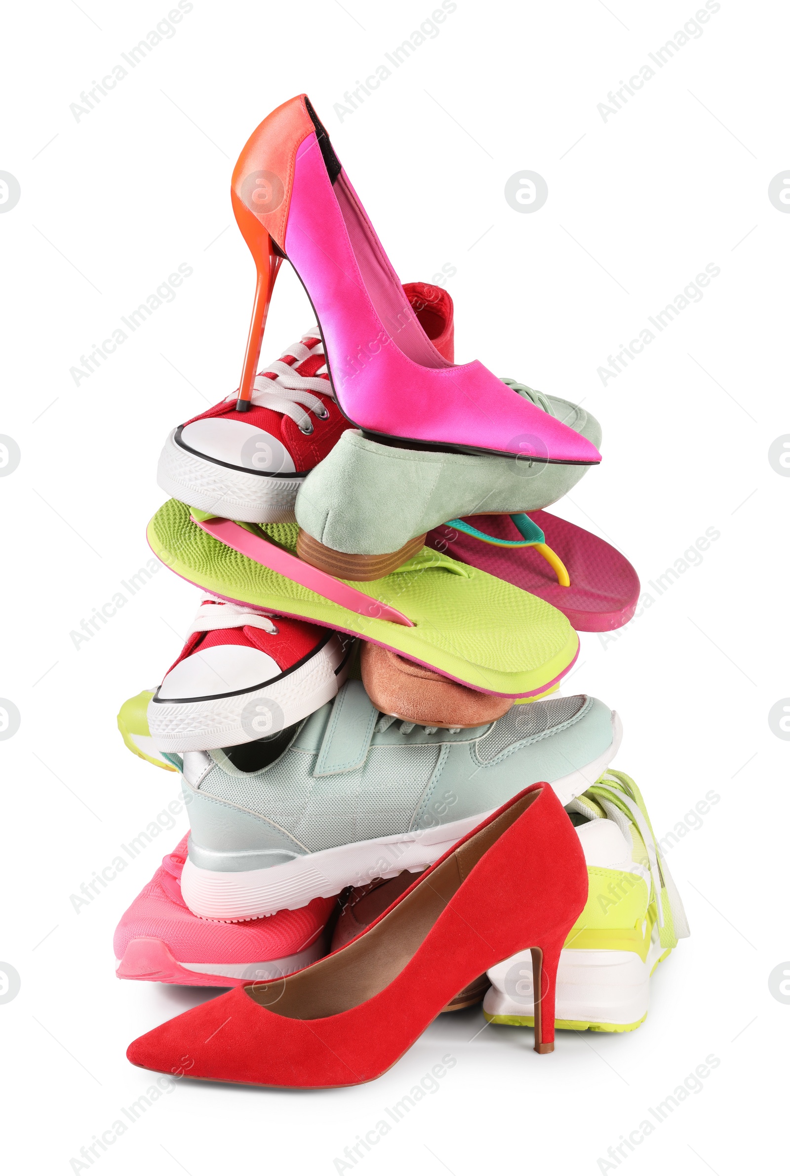 Photo of Stack of various female shoes isolated on white