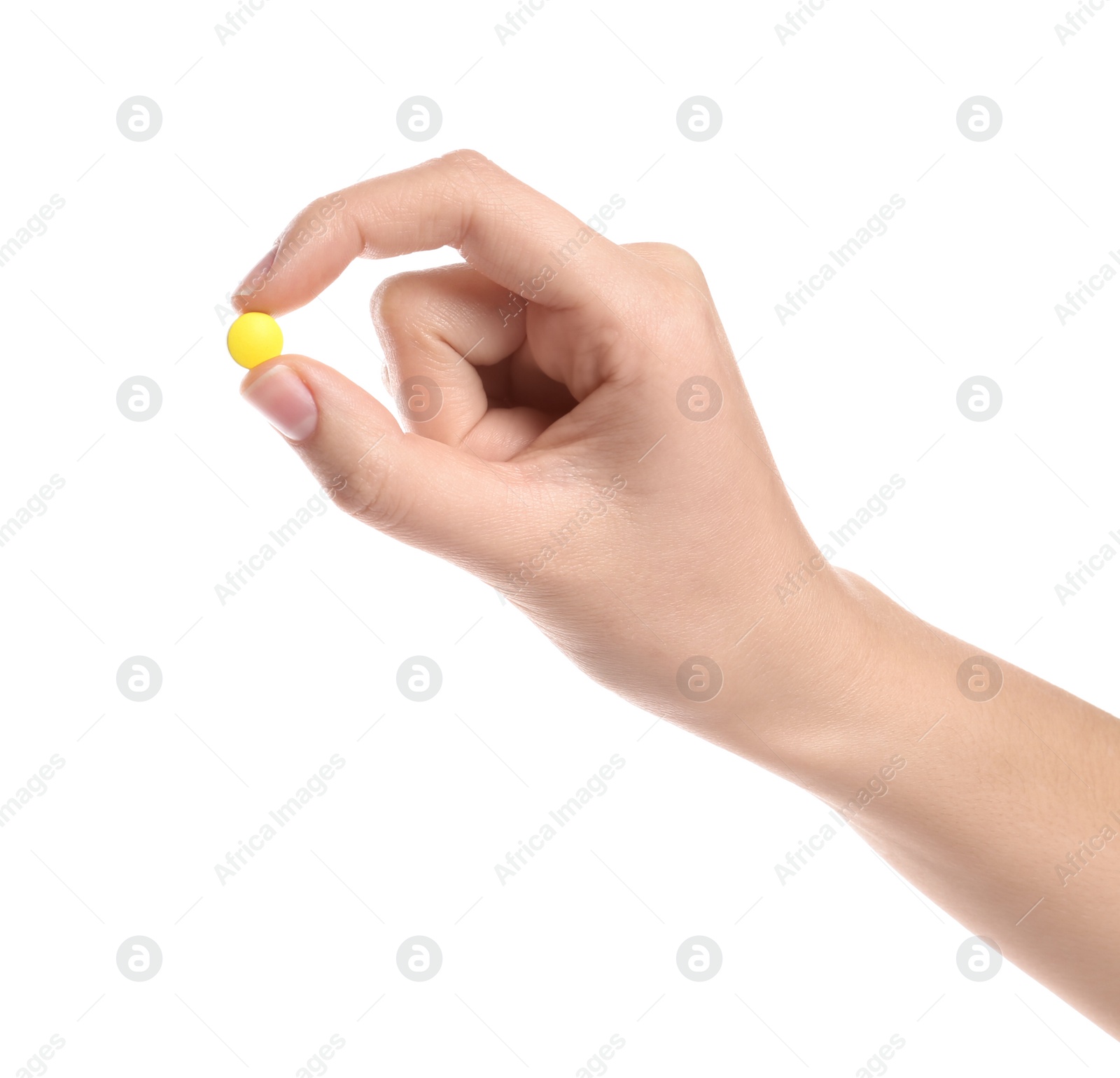 Photo of Woman holding color pill on white background, closeup