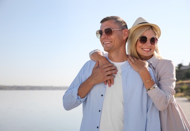 Photo of Happy couple walking outdoors on summer day