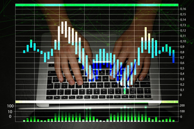 Image of Finance trading concept. Man working with laptop and chart