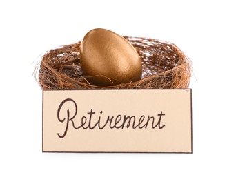 Photo of One golden egg in nest and card with word Retirement on white background. Pension concept