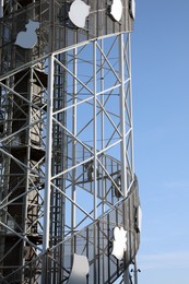 Structure of modern tower against blue sky