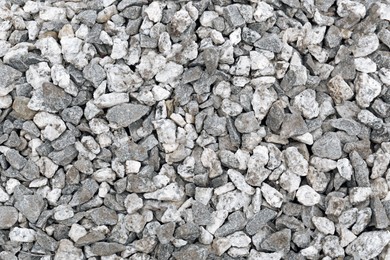 Photo of Pile of grey stones as background, top view
