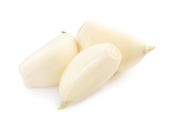 Peeled cloves of garlic isolated on white