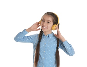 Photo of Cute little girl listening to music with headphones on white background
