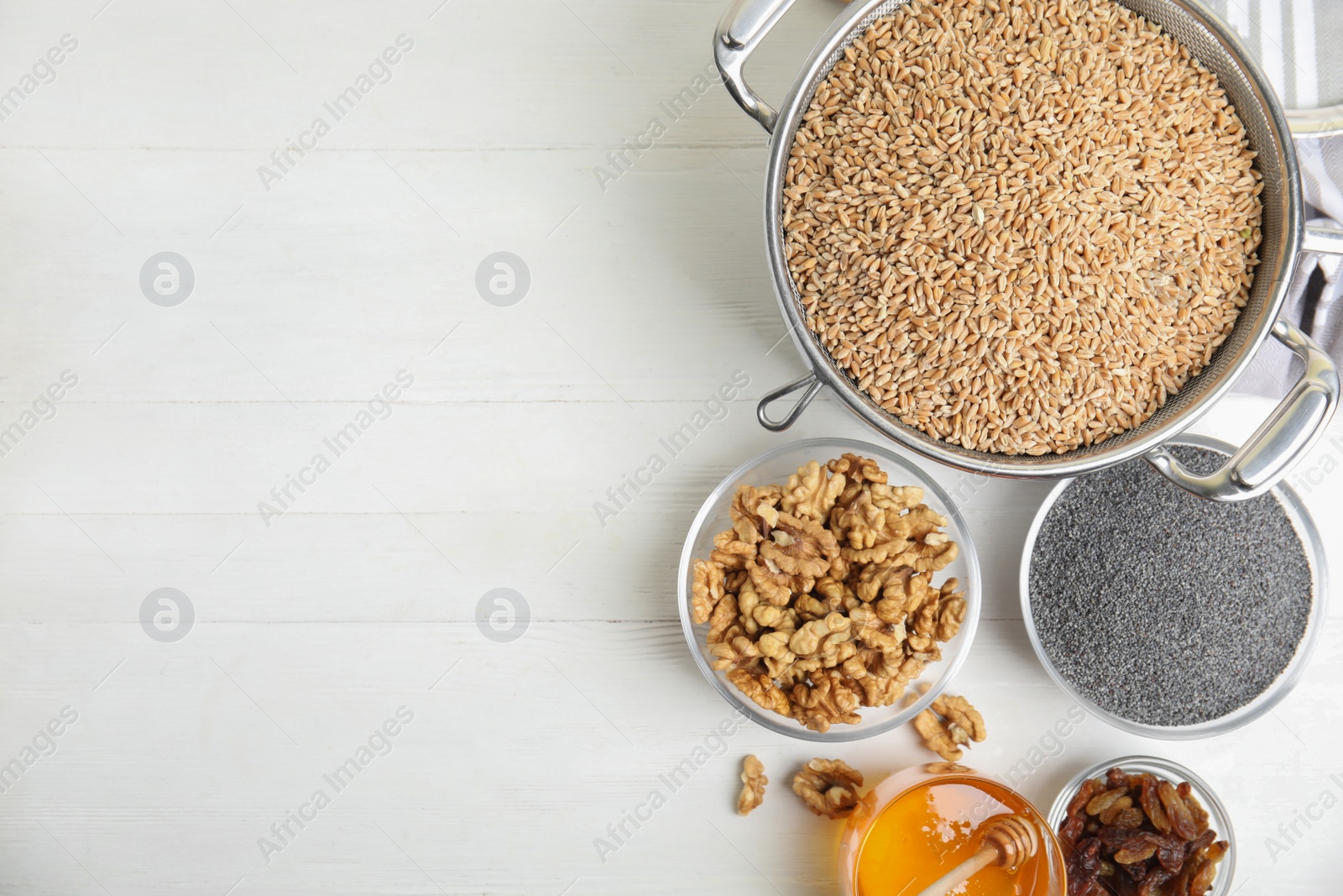 Photo of Ingredients for traditional kutia on white wooden table, flat lay. Space for text