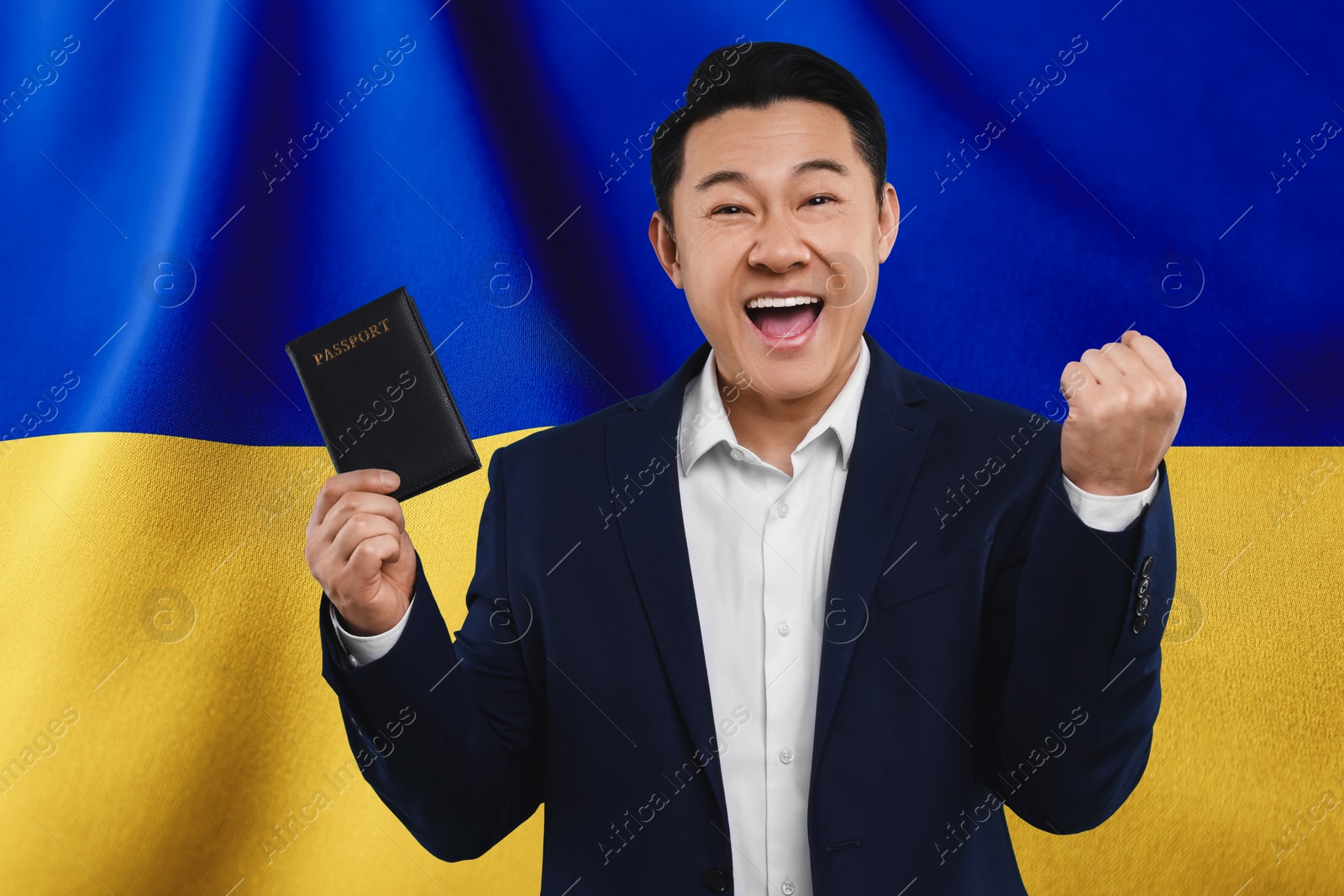 Image of Immigration. Happy man with passport against national flag of Ukraine