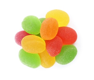 Pile of assorted jelly candies on white background, top view