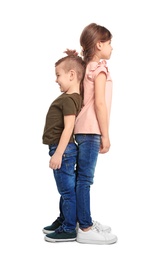 Photo of Little children measuring and comparing their height on white background