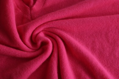 Beautiful pink fabric as background, top view