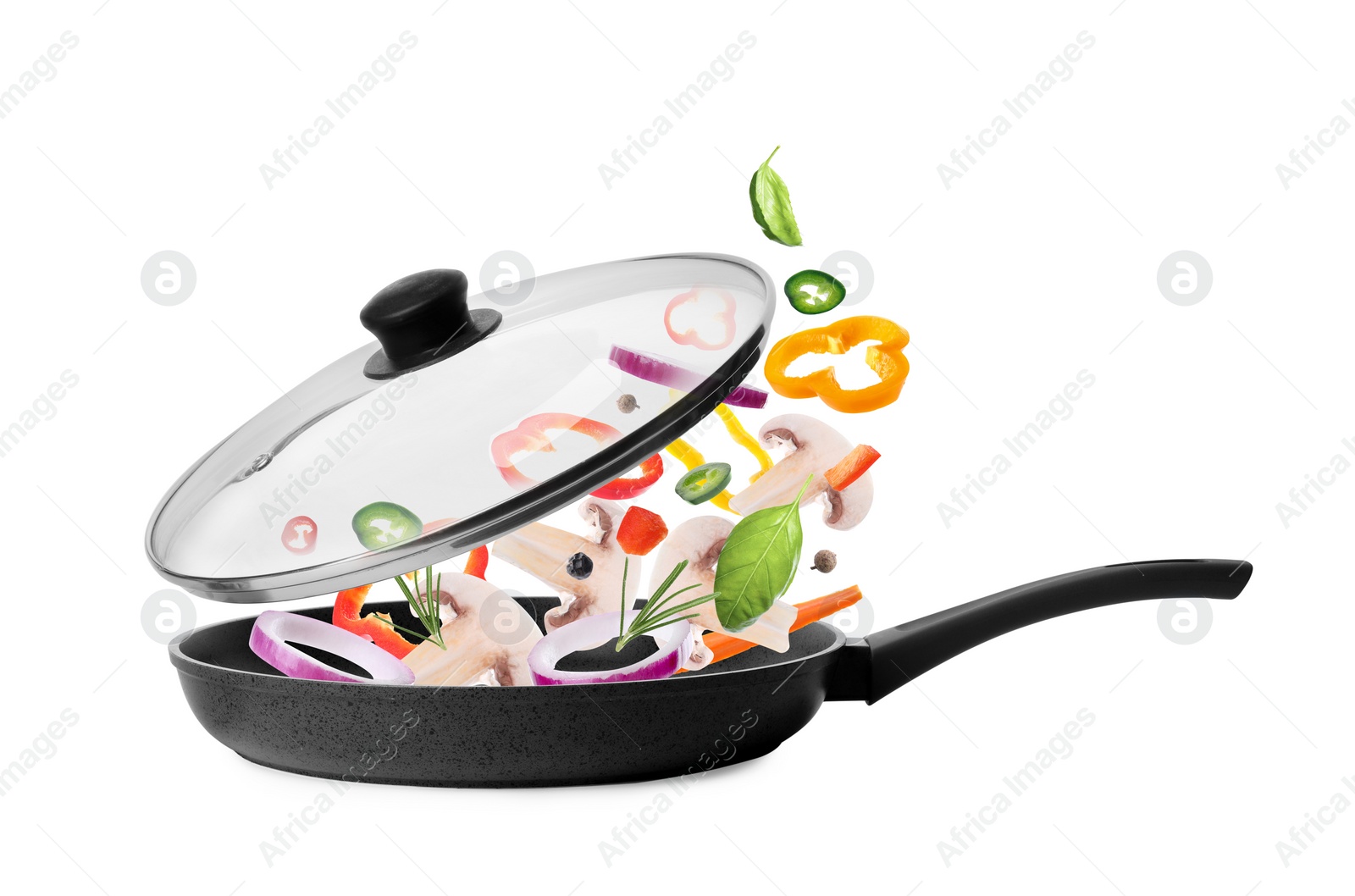 Image of Different vegetables falling into frying pan on white background. Process of cooking