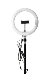 Photo of Modern ring light on stand against white background