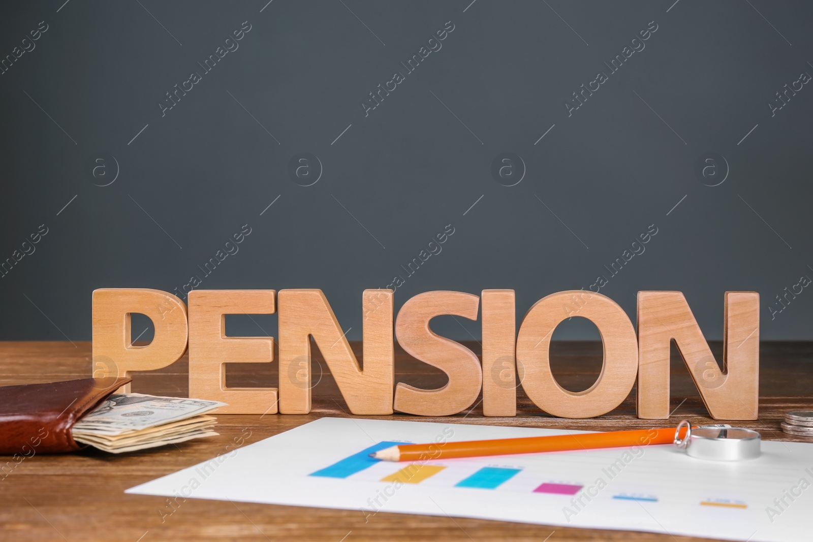Photo of Composition with word "PENSION" made of letters on table