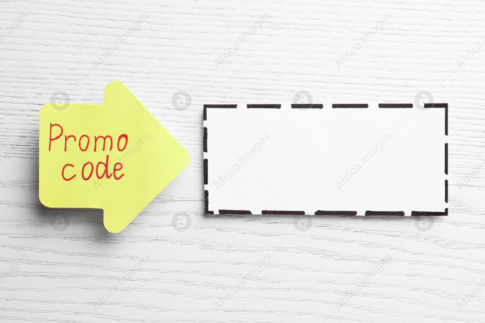 Photo of Sticky note with words Promo Code and blank card on white wooden table, flat lay