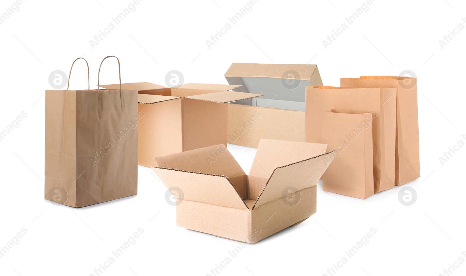 Image of Set with different paper bags and cardboard boxes on white background