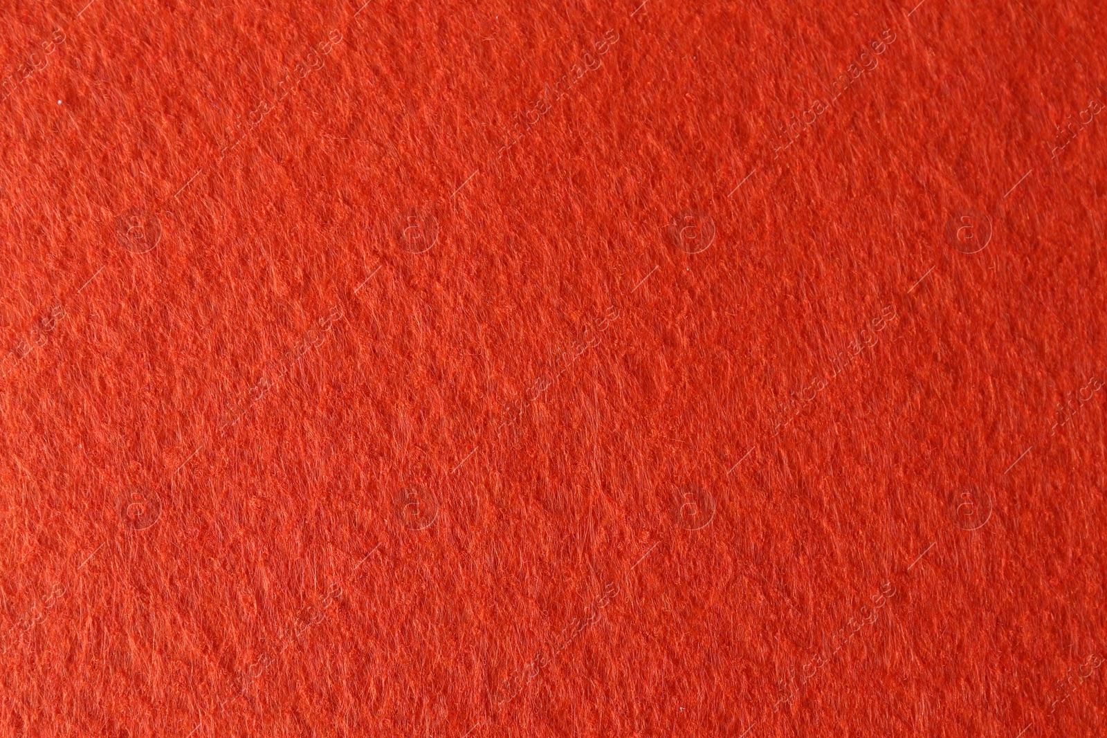 Photo of Orange textured surface as background, closeup view