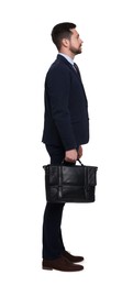 Photo of Handsome bearded businessman in suit with briefcase on white background