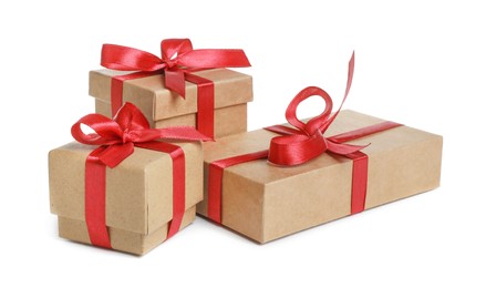 Photo of Christmas present. Many kraft gift boxes on white background