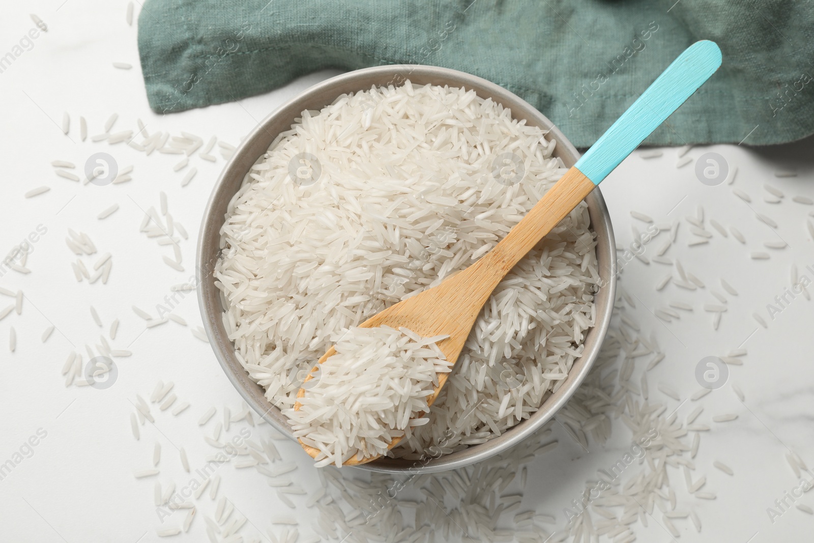 Photo of Raw basmati rice on white table, top view