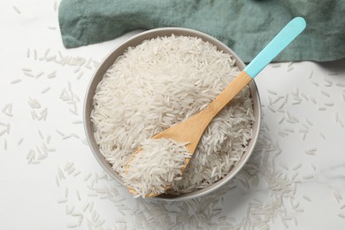 Photo of Raw basmati rice on white table, top view