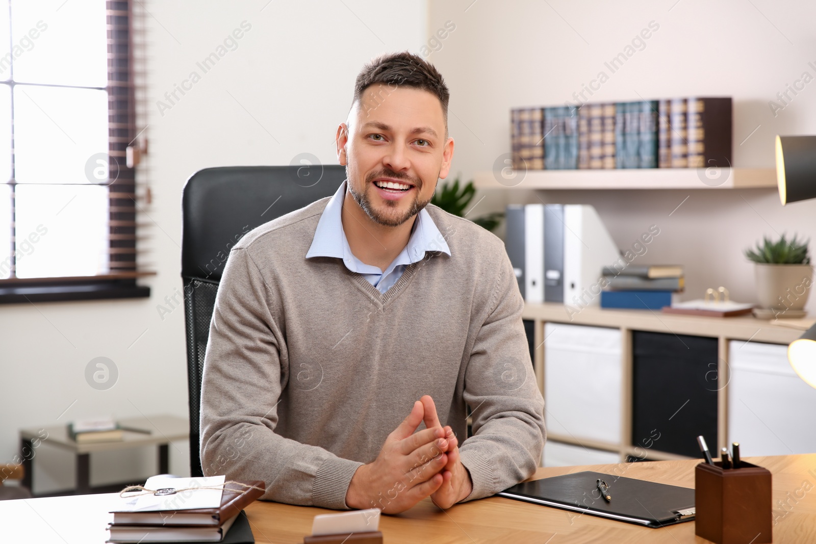 Photo of Man using video chat in office, view from web camera