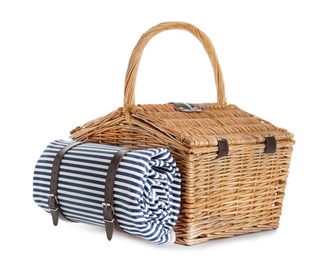Photo of Closed wicker picnic basket with blanket on white background
