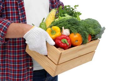 Photo of Harvesting season. Farmer holding wooden crate with vegetables on white background, closeup