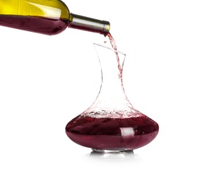 Photo of Pouring red wine into elegant decanter on white background