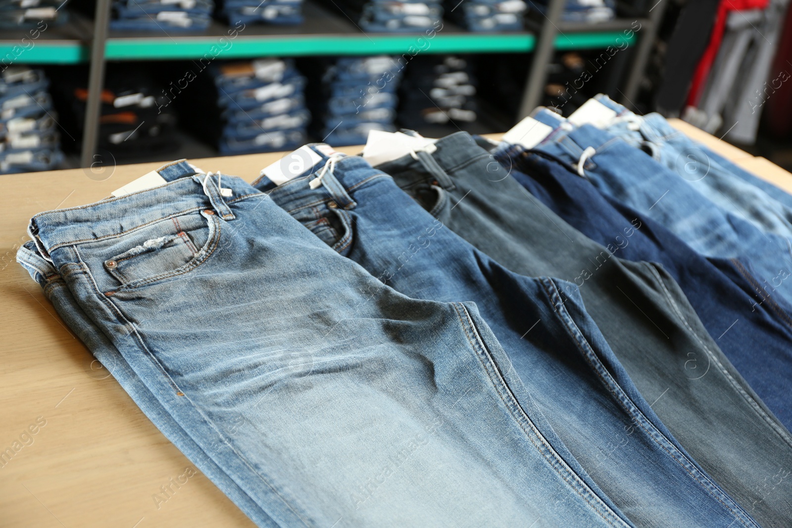 Photo of Stylish blue jeans on display in shop