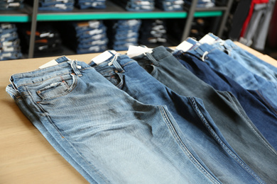 Stylish blue jeans on display in shop
