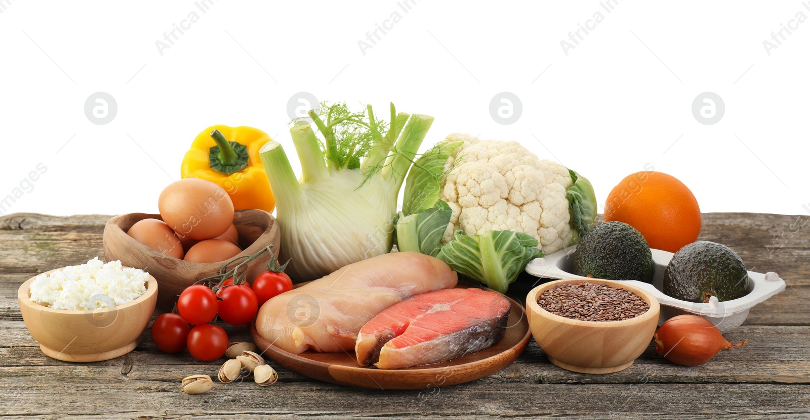 Photo of Healthy food. Different fresh products on wooden table against white background