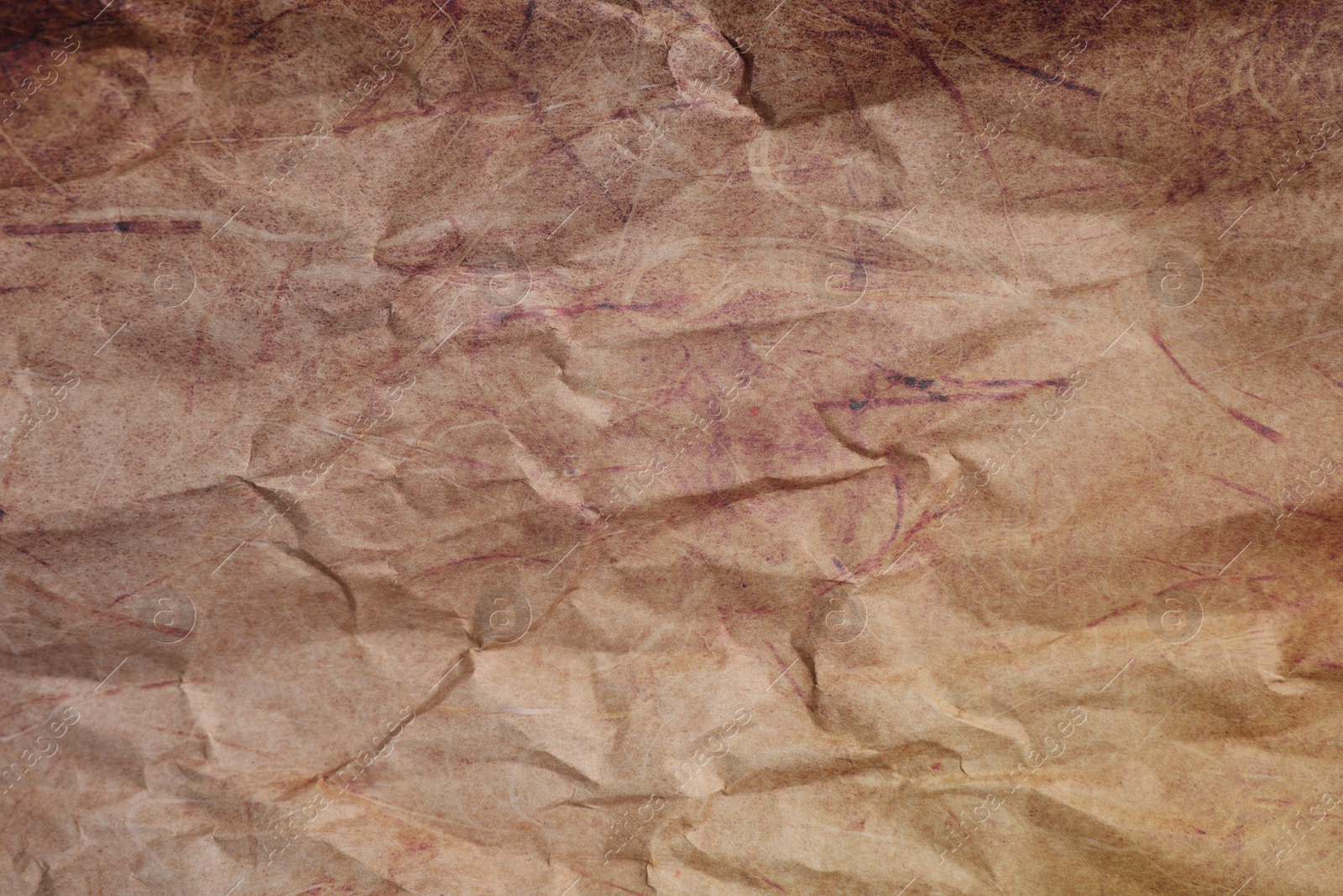 Photo of Texture of crumpled parchment paper as background, top view