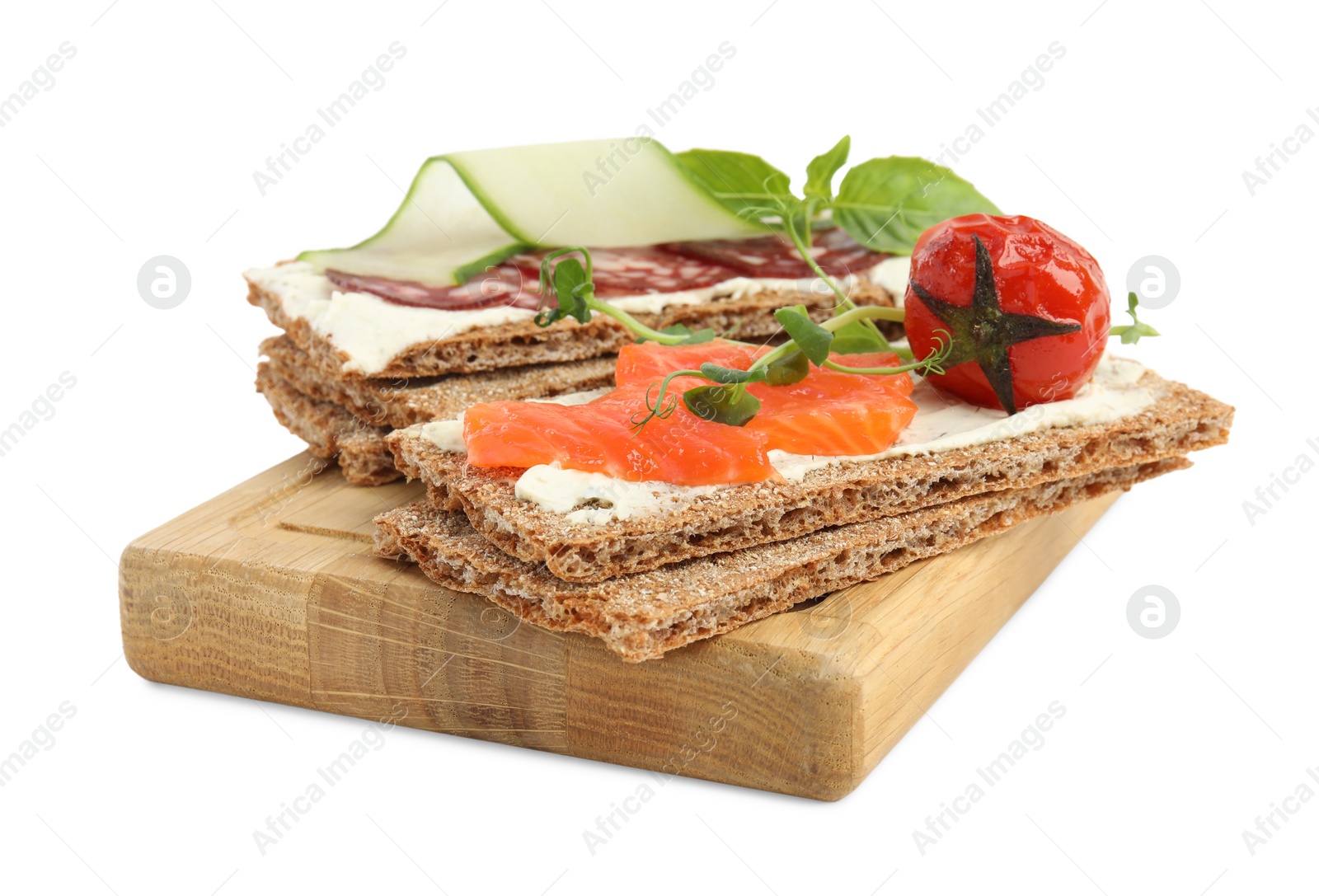 Photo of Fresh rye crispbreads with different toppings on white background