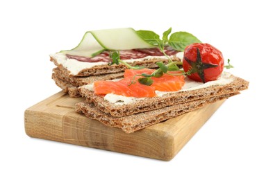 Photo of Fresh rye crispbreads with different toppings on white background