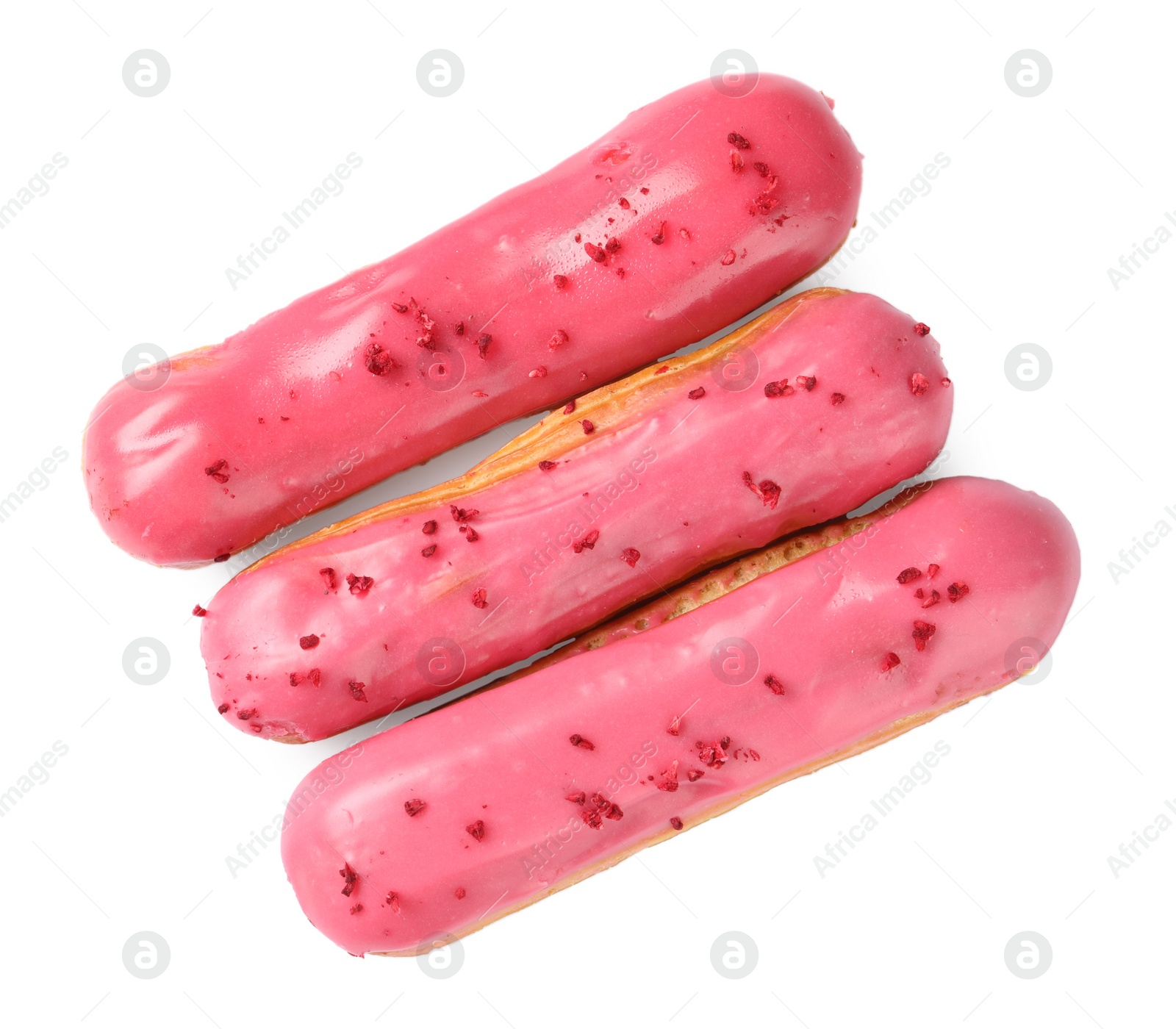 Photo of Delicious eclairs covered with pink glaze isolated on white, top view